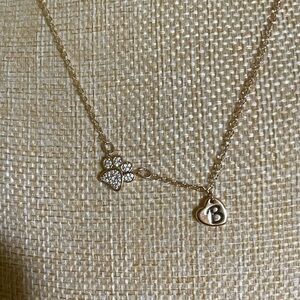 💫$10 add on. Gold necklace with rhinestone paw pendant and heart charm